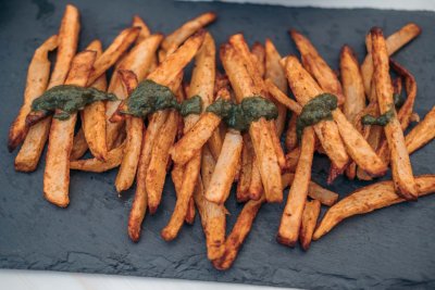 Delicious fries with chimichurri sauce