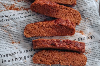Delicious vegan brisket cuts up close on a newspaper