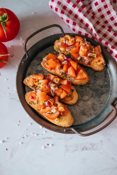 authentic Bruschetta Italiana with olive oil, basil and tomatoes