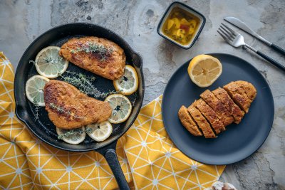 Delicious vegan chicken in skillet with lemon and thyme