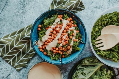 Super tasty vegan caesar salad served in a blue bowl