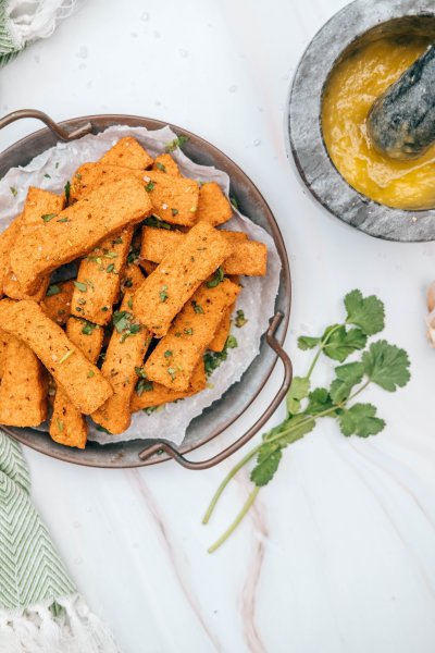 Perfectly crispy air fryer polenta chips with garlic dip on the side