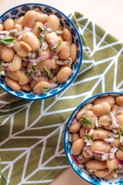 Two bowls of gigante beans salad