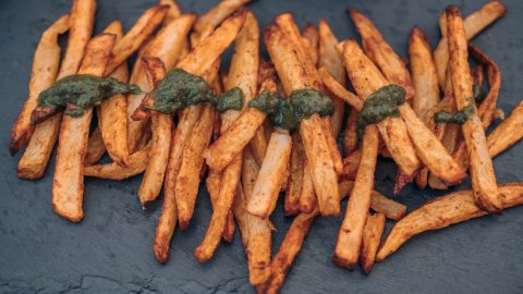 Delicious fries with chimichurri sauce