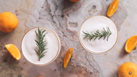 Delicious triple sec cocktail served with vegan albumin and rosemary