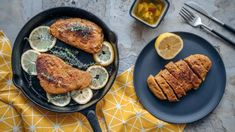 Delicious vegan chicken in skillet with lemon and thyme