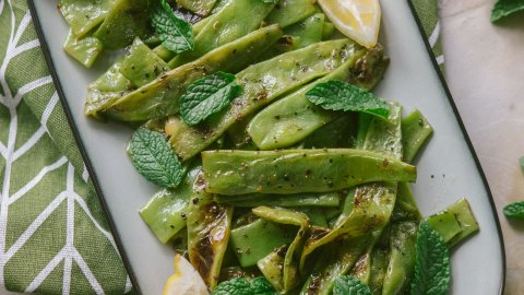 Perfectly grilled and seasoned Italian flat beans with lemon and mint